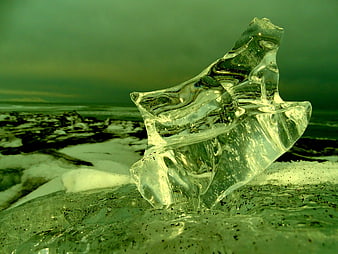 Crystal Clear Ice Sculpture on Black Sand Beach