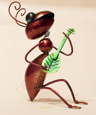 Metal Ant Sculpture Playing Green Guitar on White Background