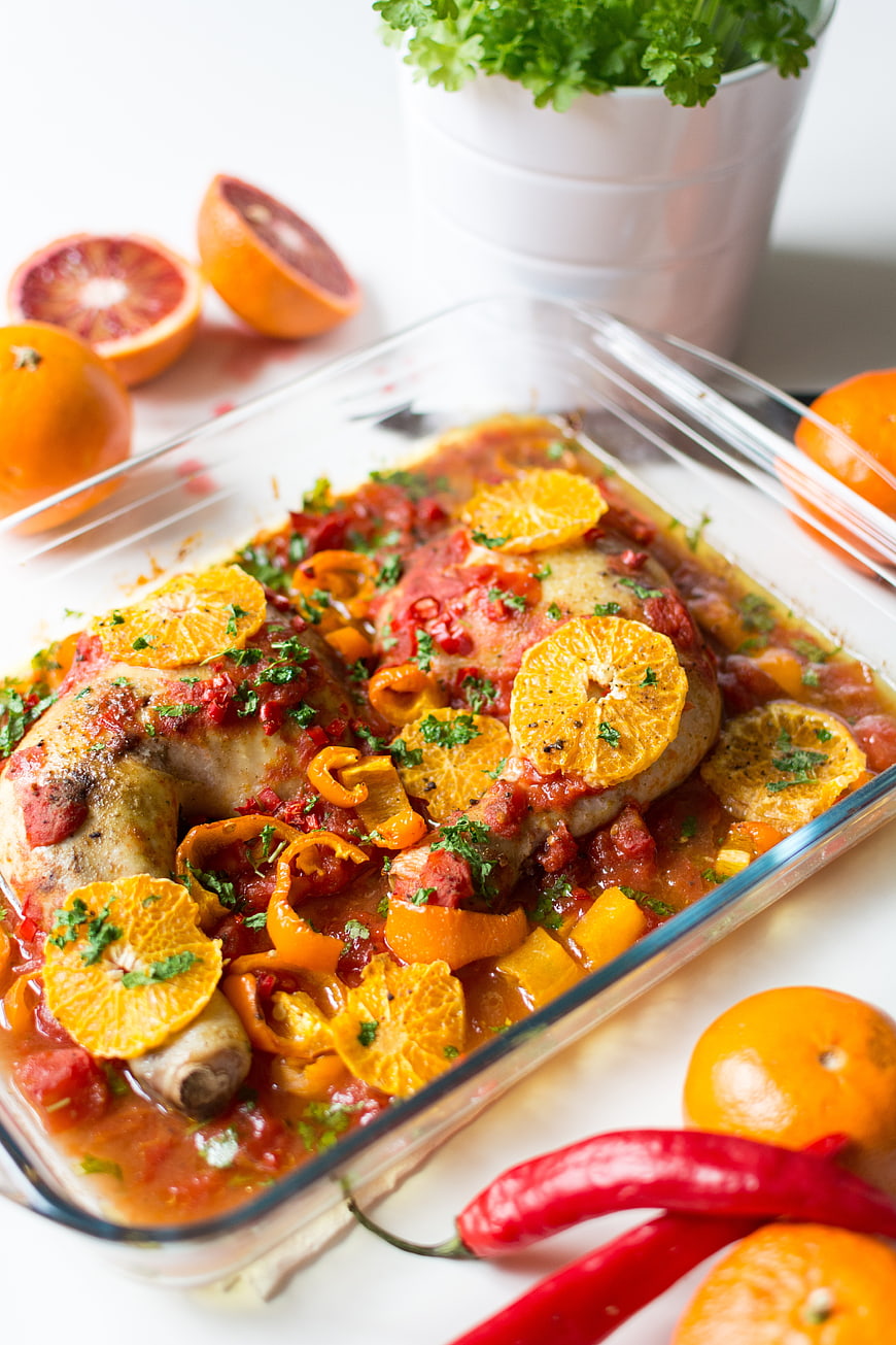 Roasted Chicken Legs with Oranges and Peppers in Glass Dish