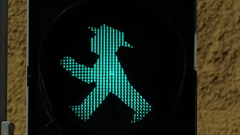 Close-up of green pedestrian traffic light signal