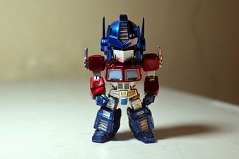 Optimus Prime Transformers Action Figure Standing on White Surface