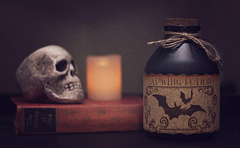 Halloween Potion Bottle with Skull and Vintage Book