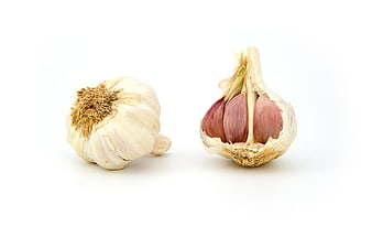 Whole and Split Garlic Bulbs on White Background