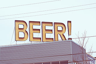 Retro Marquee Beer Sign on Building Roof