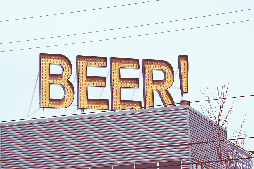 Retro Marquee Beer Sign on Building Roof