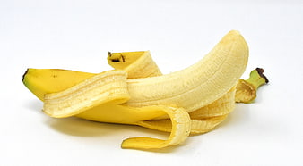 Peeled Yellow Banana On White Background