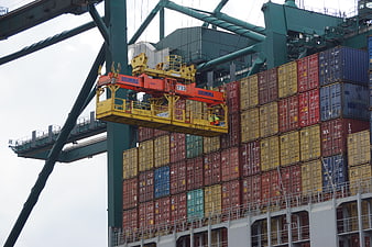 Container Ship Loading Operation With Large Yellow Crane