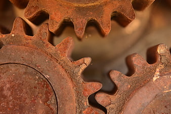 Close-up of rusty interlocking metal gears