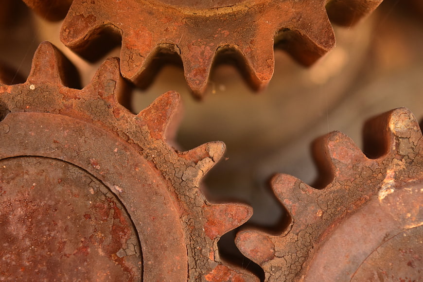 Close-up of rusty interlocking metal gears