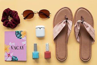 Summer Vacation Flat Lay with Sandals, Sunglasses, and Travel Essentials