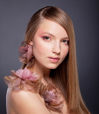 Portrait of young woman with floral fabric accessories