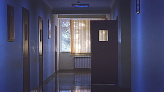 Empty Blue Hospital Corridor with Open Door