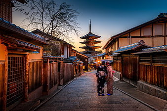 Women in Kimonos Walking in Kyoto Street at Dusk
