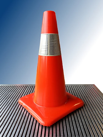 Orange Traffic Cone with Reflective Stripe on Metal Surface