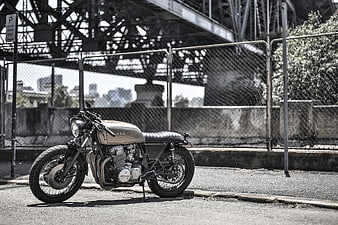 Custom Honda Cafe Racer Motorcycle Parked Under Urban Bridge