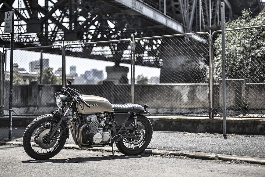 Custom Honda Cafe Racer Motorcycle Parked Under Urban Bridge