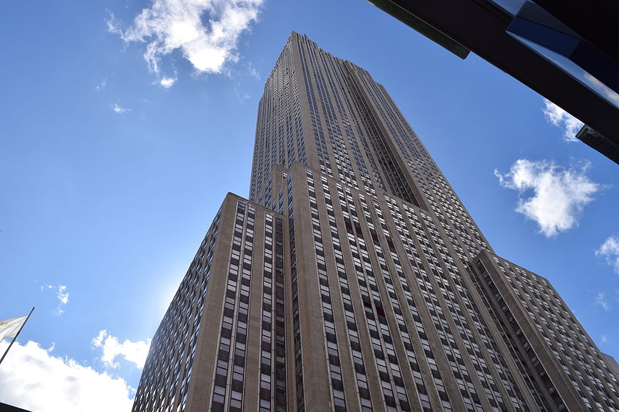 Low angle view of Empire State Building against blue sky