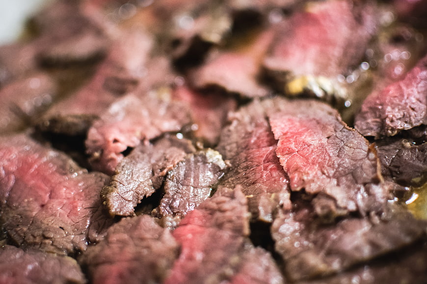 Close-up of juicy medium-rare sliced roast beef