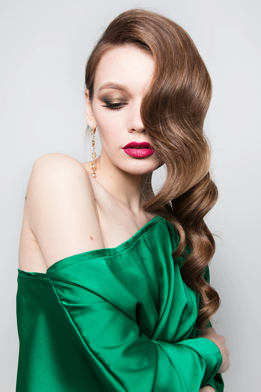 Elegant Woman in Green Dress with Red Lips