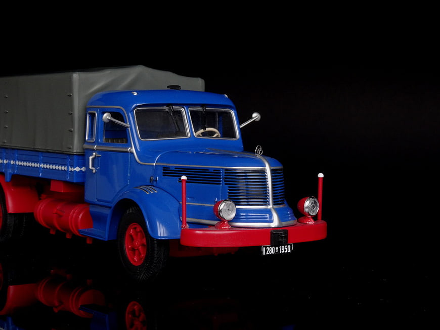 Vintage Blue Toy Truck Model on Black Background