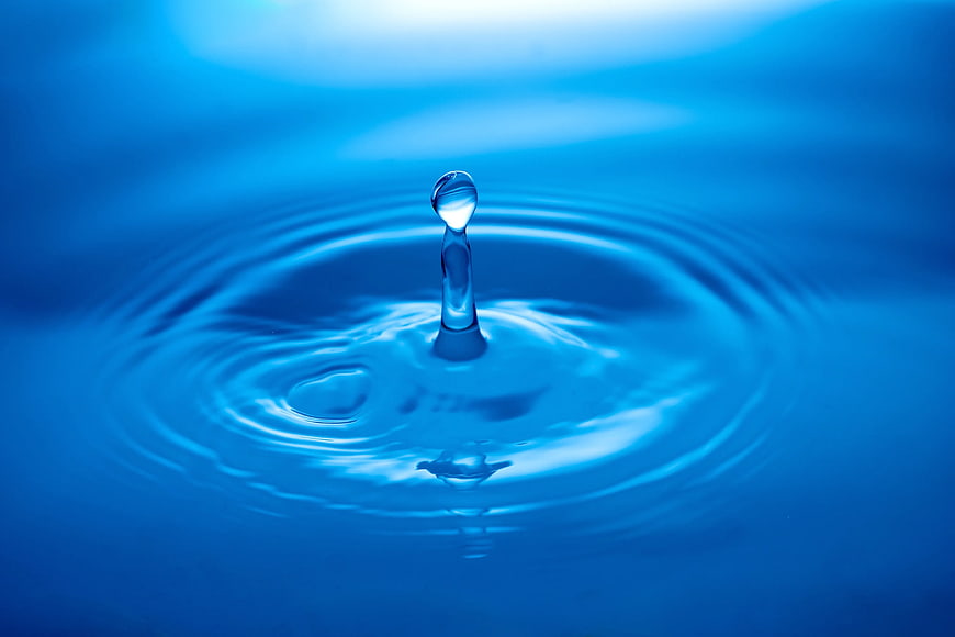 Close-up of a water droplet splash with ripples
