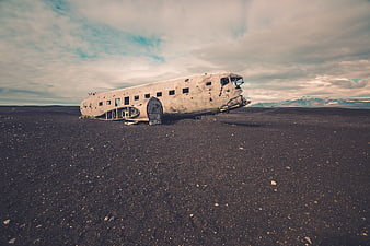 Abandoned DC-3 airplane wreck on black sand beach in Iceland