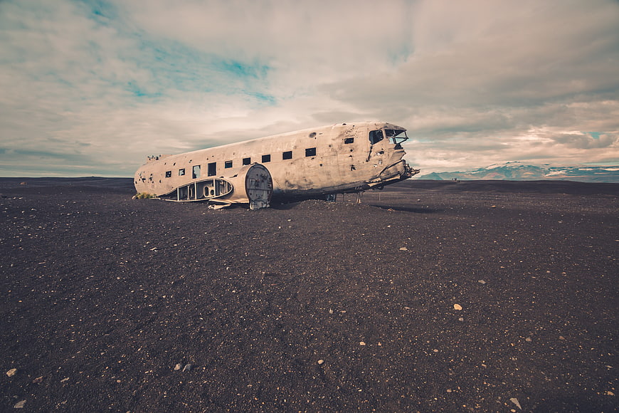 Abandoned DC-3 airplane wreck on black sand beach in Iceland