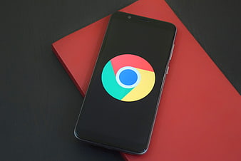Smartphone displaying Google Chrome logo on red and black background