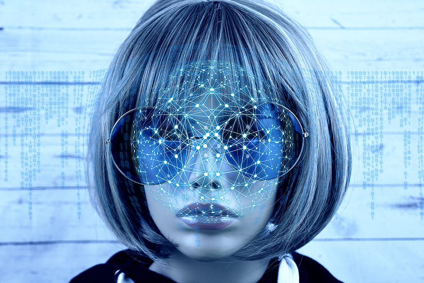 Woman with digital network overlay and binary code background