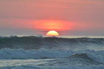 Sunset Over Ocean Waves