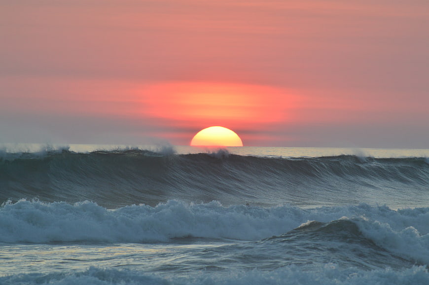 Sunset Over Ocean Waves
