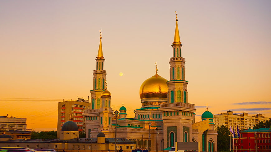 Golden Mosque with Minarets at Sunset