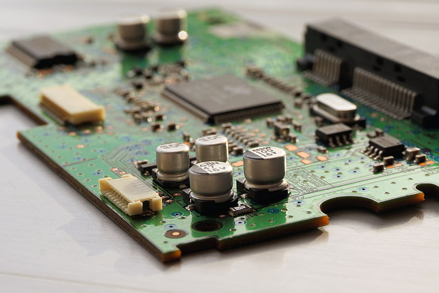 Close-up of green circuit board with electronic components
