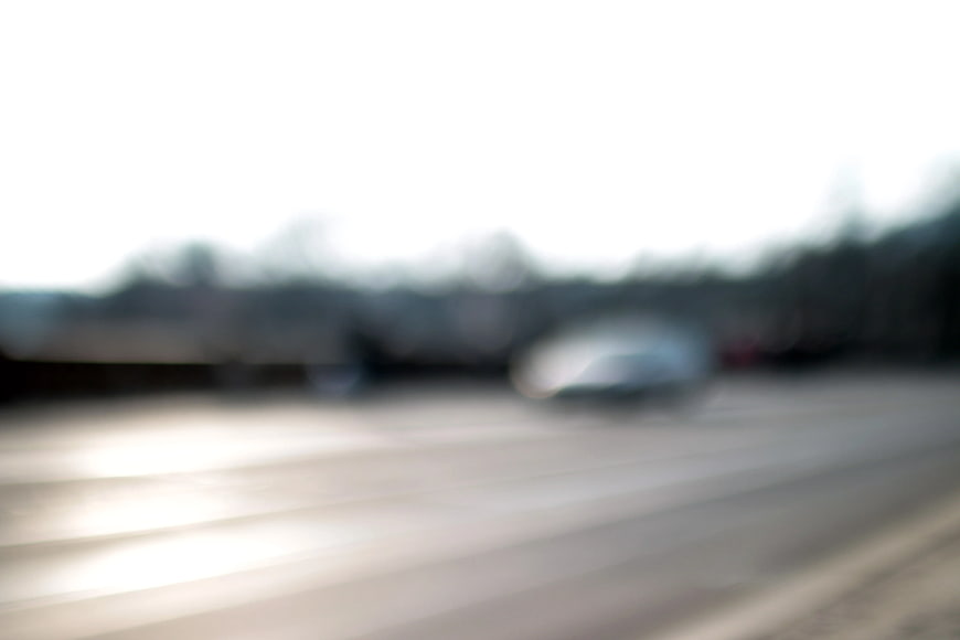 Blurred Abstract Background of a Car on a Road