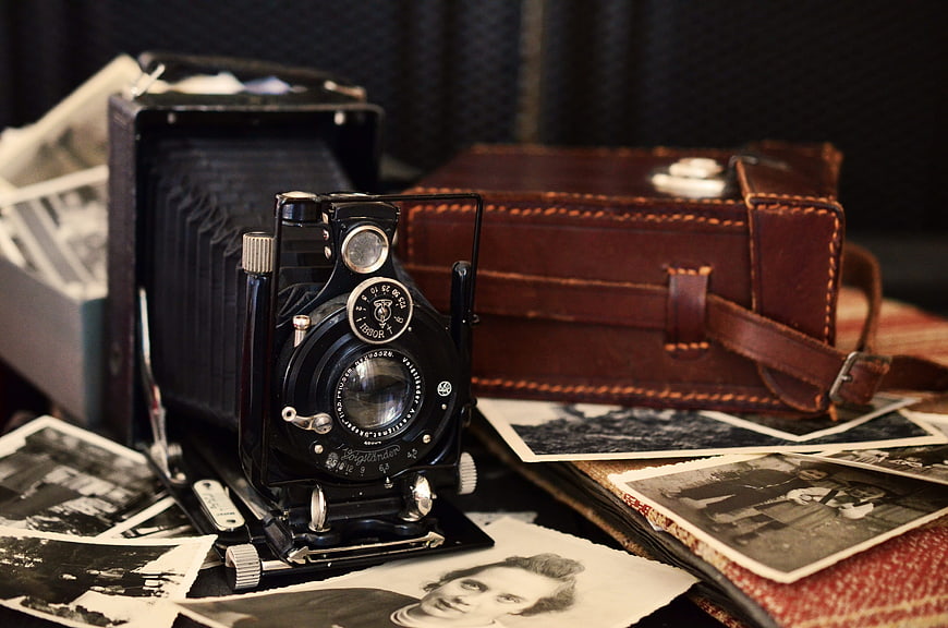 Vintage Voigtländer Camera with Old Photos and Leather Case