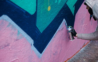 Graffiti Artist Painting Colorful Mural on Wall