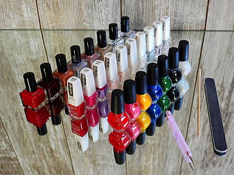 Colorful Nail Polish Collection On Glass Shelf