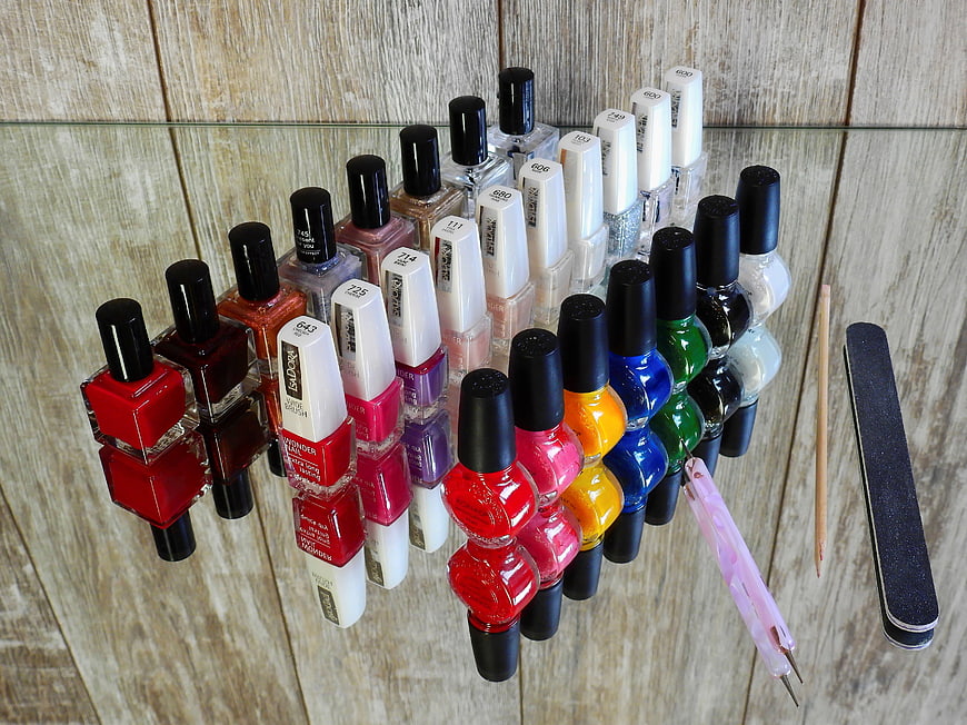 Colorful Nail Polish Collection On Glass Shelf