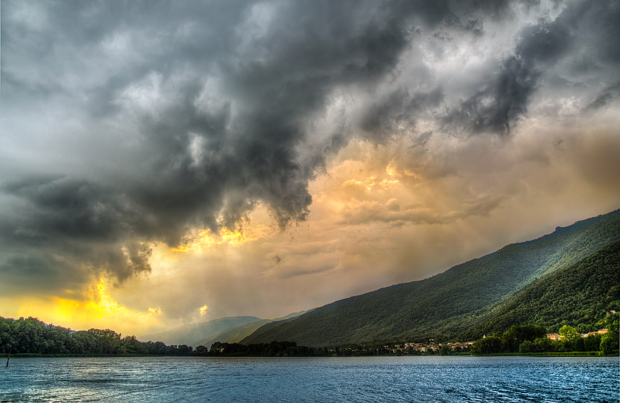 Dramatic Stormy Sky Over Lake and Mountains