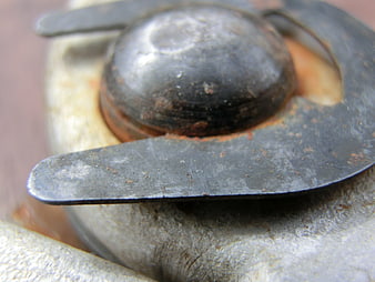Close-up of weathered metal bolt head and washer
