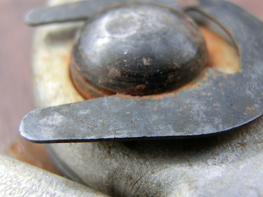 Close-up of weathered metal bolt head and washer