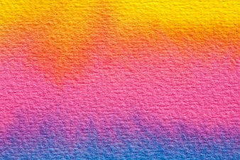 Colorful textured paper background with yellow, pink, and blue gradient