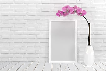 White Picture Frame Mockup With Pink Orchid Vase On Brick Wall