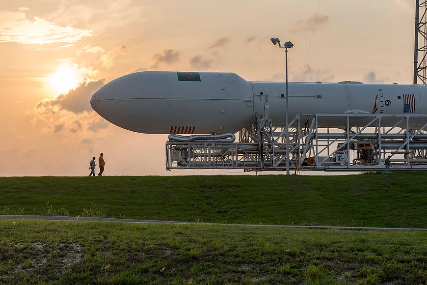 SpaceX Falcon 9 rocket transport at sunset