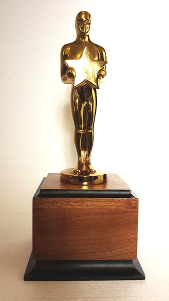 Gold Oscar-Style Award Trophy on Wooden Base