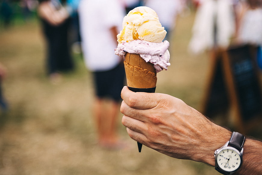 Hand Holding Ice Cream Cone with Watch