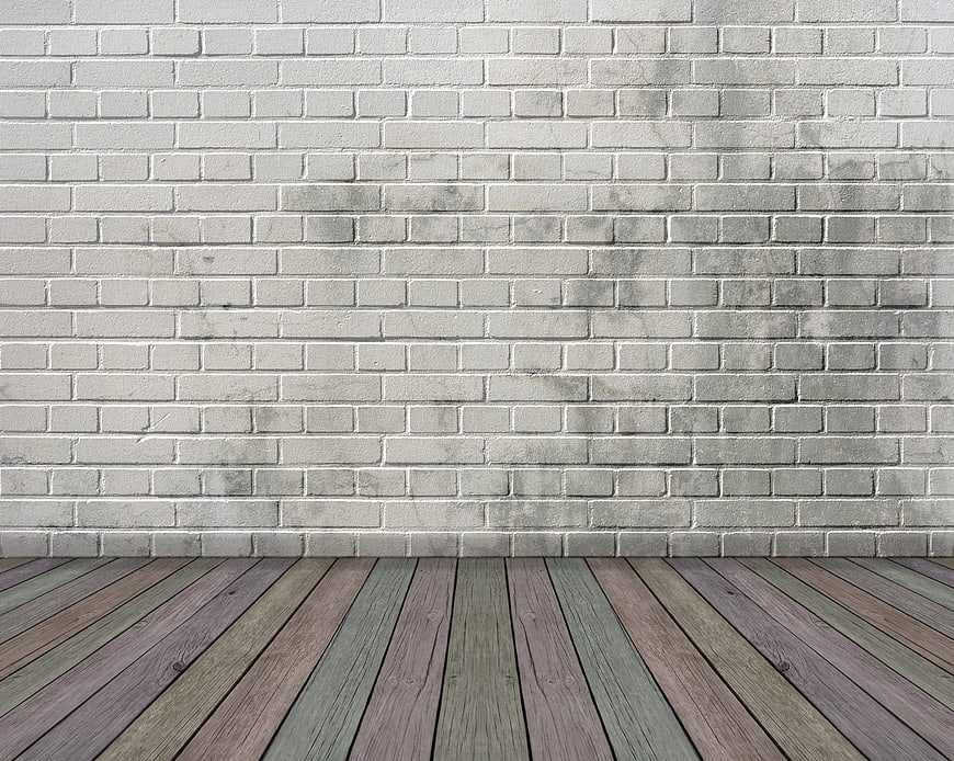 Empty Room Interior With White Brick Wall And Weathered Wooden Floor