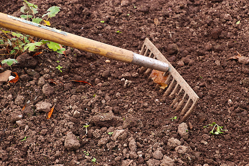 Garden Rake on Cultivated Soil