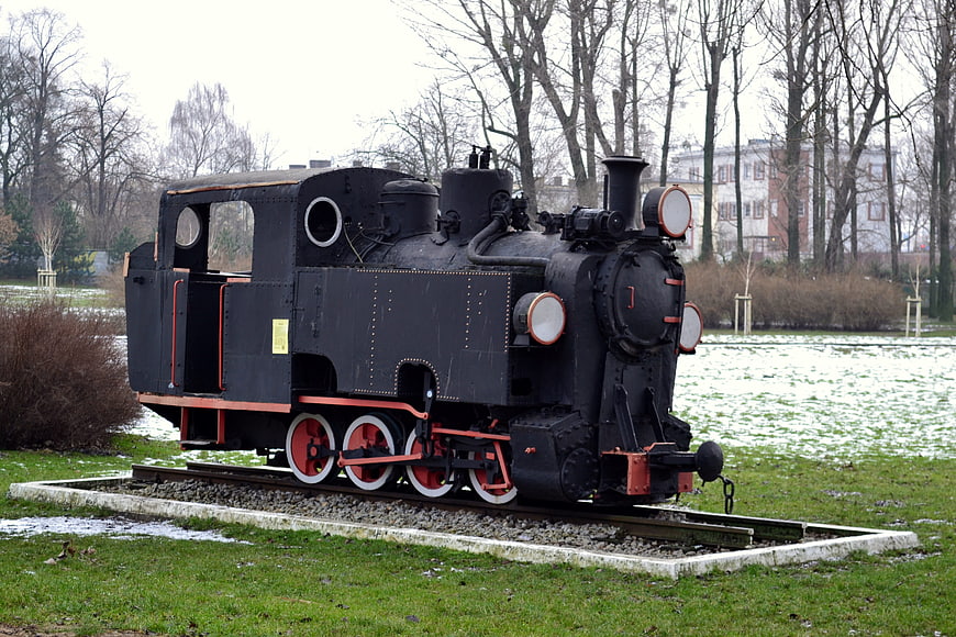 Vintage black steam locomotive on display in a park