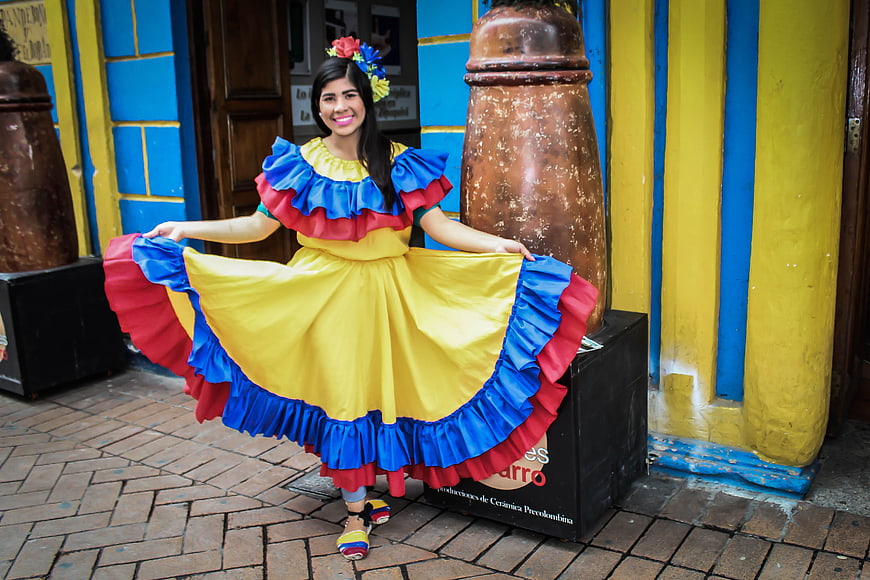 Woman in Traditional Colombian Dress Dancing